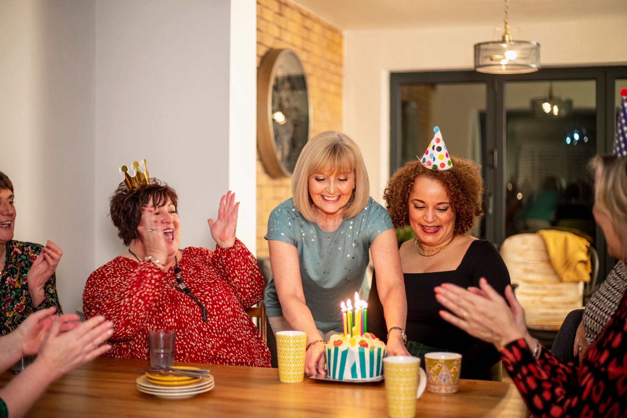 Styled birthday celebration with cake and guests